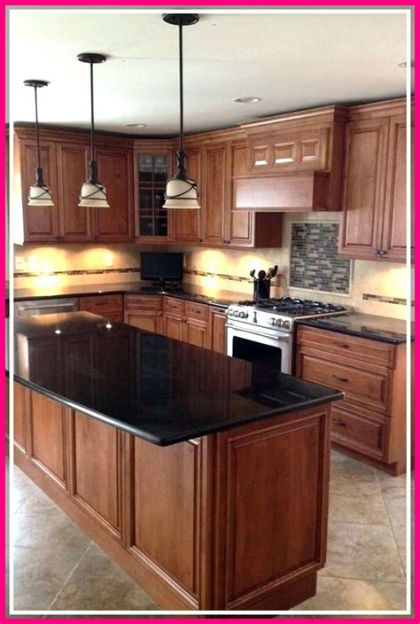 stainless steel appliance in light or dark wood cabinets|kitchen with dark wood cabinet.